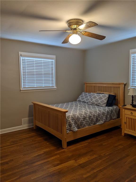 223 S Trail Butler, PA 16002 - Photo 10 of 24 a bedroom with a bed and a chandelier