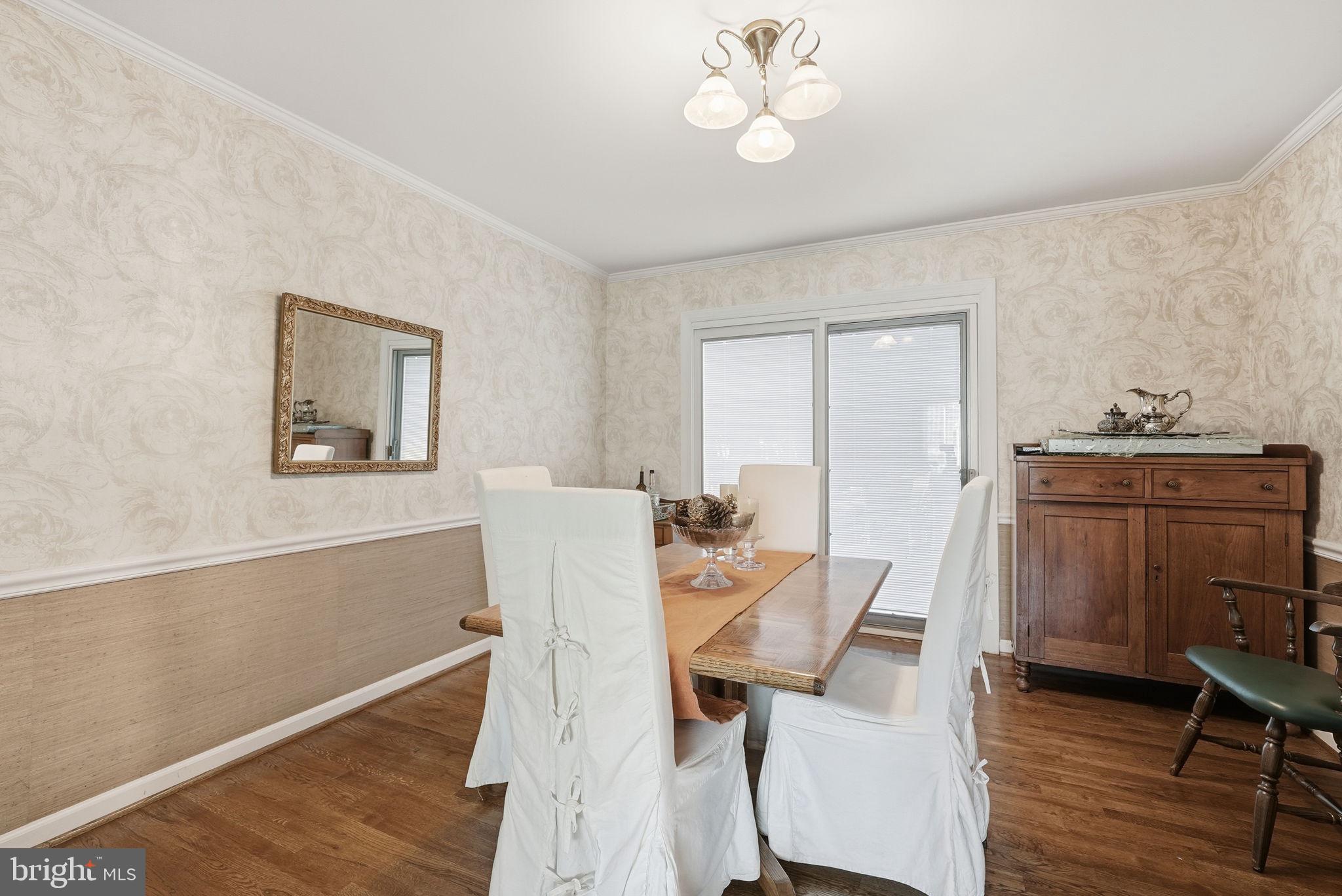13621 North Gate Drive Silver Spring, MD 20906 - Photo 11 of 54 a view of a dining room with furniture and wooden floor