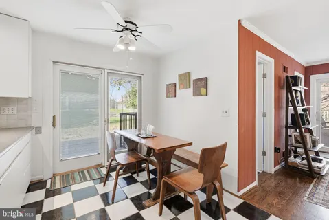 a view of a livingroom with furniture and a window