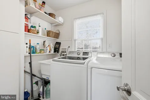 a spacious bedroom with a bed and a window