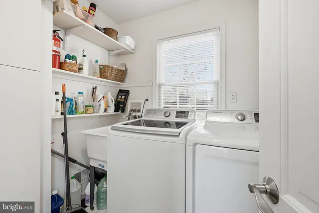 a spacious bedroom with a bed and a window