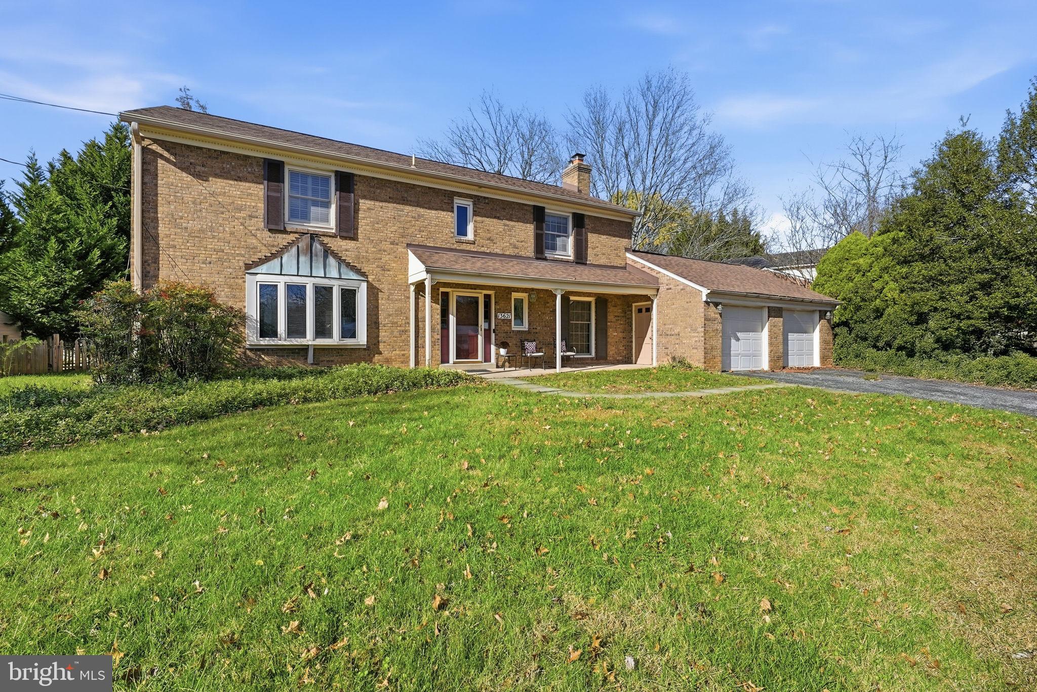 13621 North Gate Drive Silver Spring, MD 20906 - Photo 2 of 54 a front view of a house with a garden