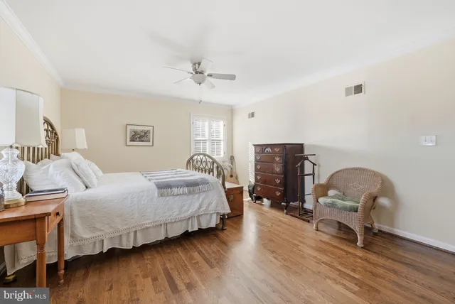 a living room with furniture and a mirror
