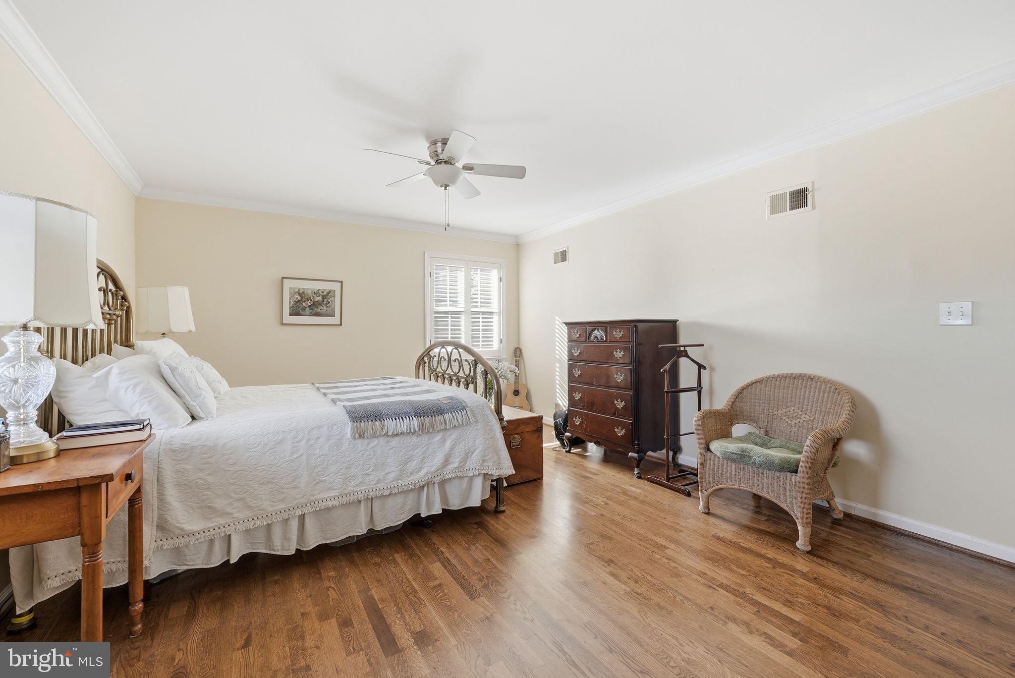 13621 North Gate Drive Silver Spring, MD 20906 - Photo 24 of 54 a bedroom with a bed a desk and chair