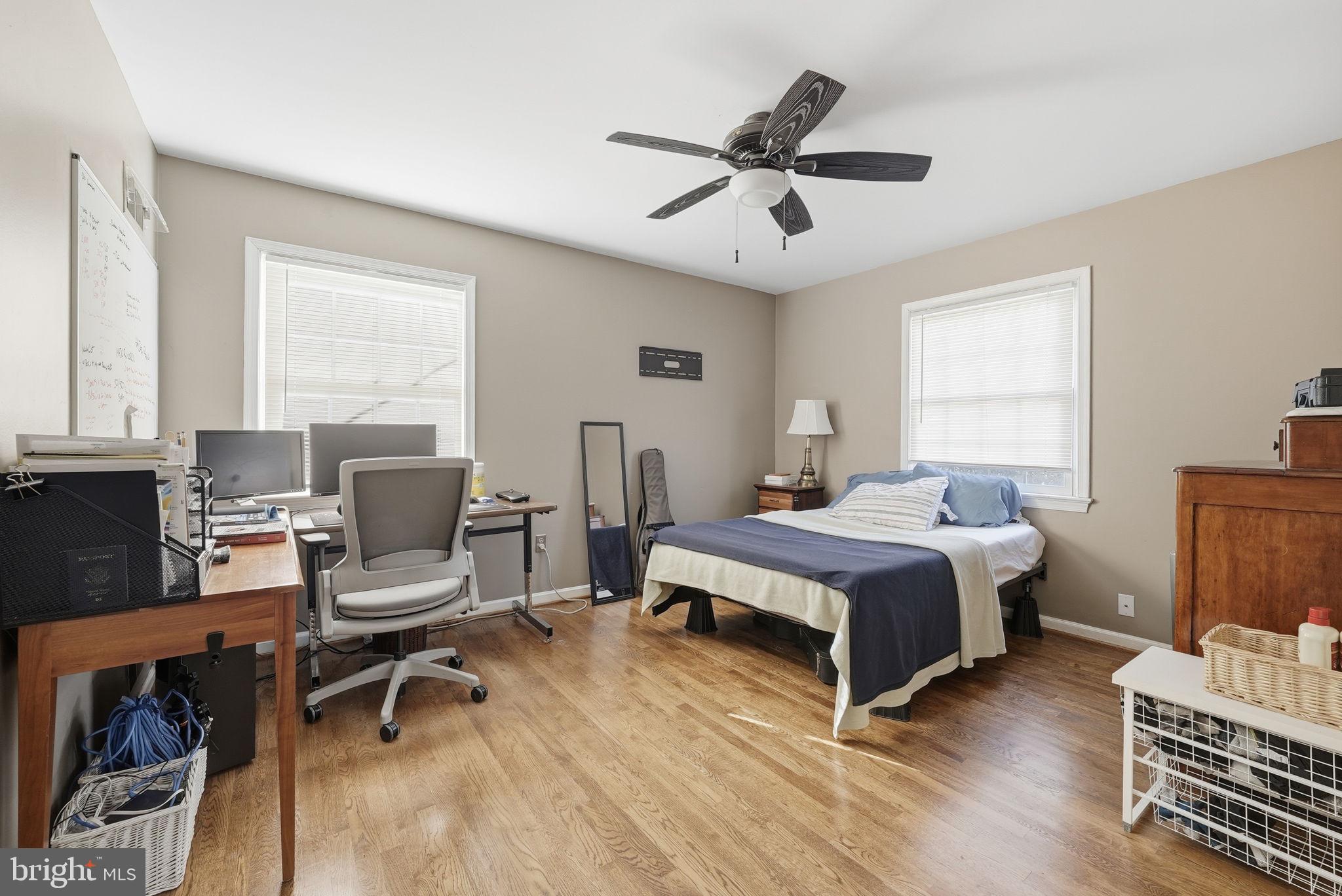 13621 North Gate Drive Silver Spring, MD 20906 - Photo 30 of 54 a spacious bedroom with a bed and a desk