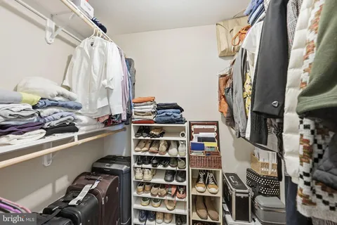 a bathroom with a toilet and a mirror