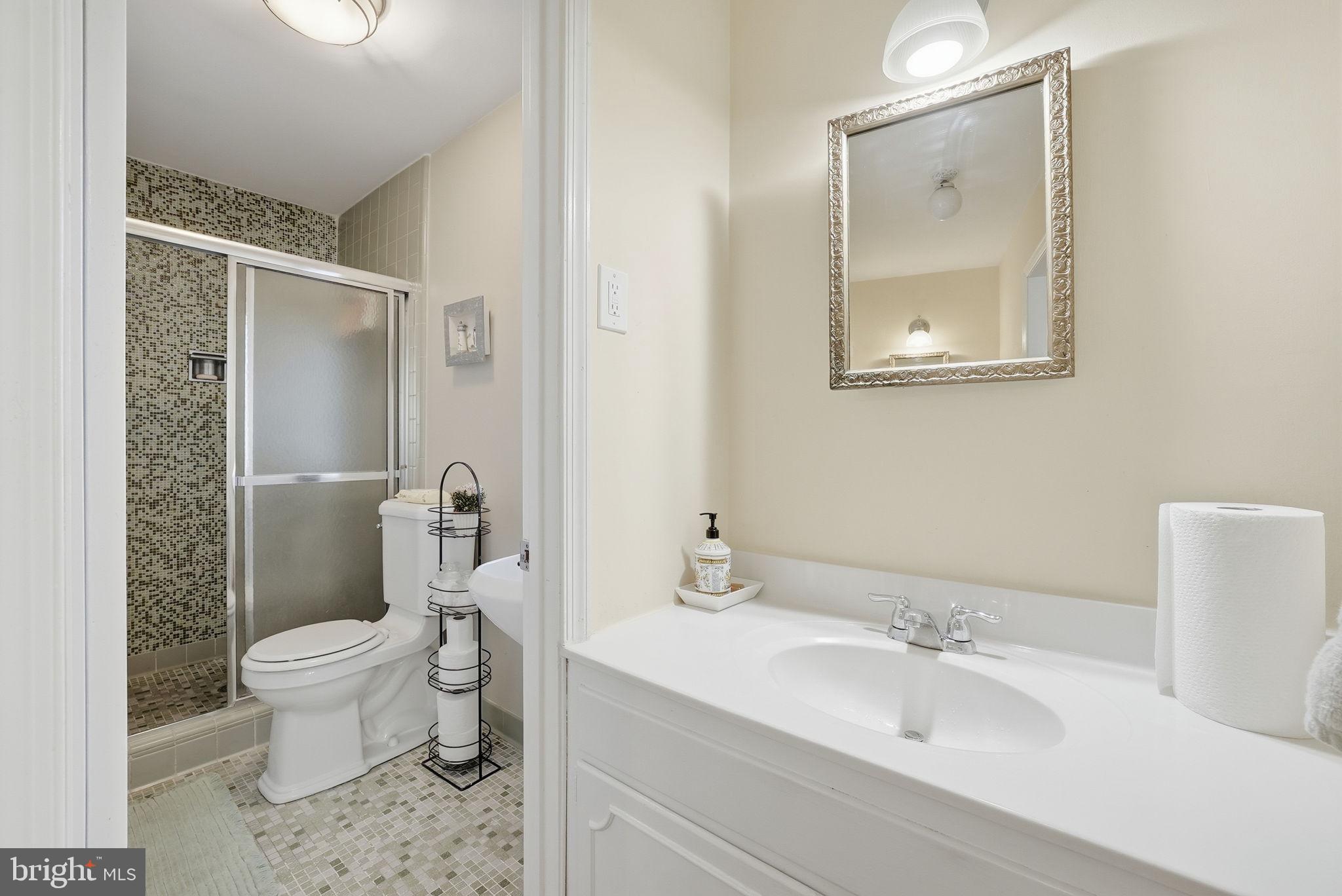 13621 North Gate Drive Silver Spring, MD 20906 - Photo 36 of 54 a bathroom with a sink toilet and shower