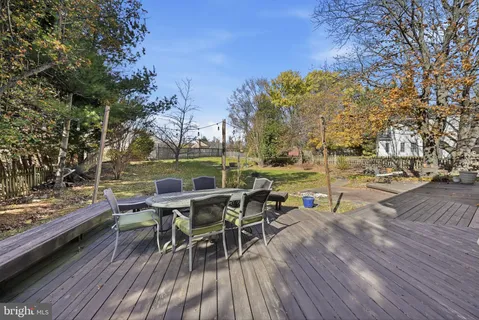 a view of a chairs and table in the patio