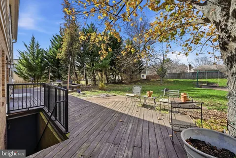 a living room with lots of furniture and a book shelf