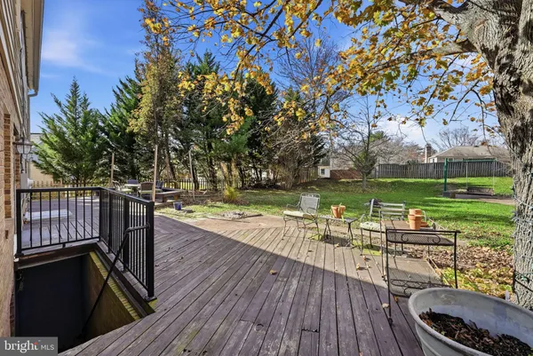 a living room with lots of furniture and a book shelf