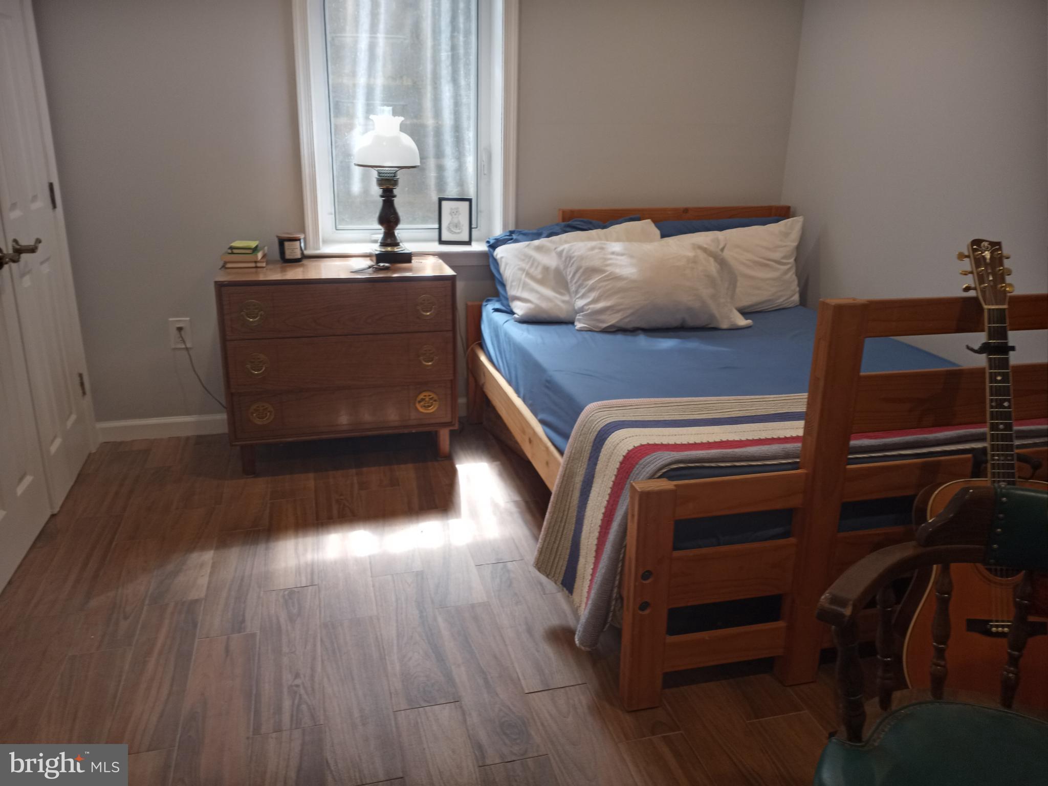 13621 North Gate Drive Silver Spring, MD 20906 - Photo 48 of 54 a bedroom with a bed and wooden floor