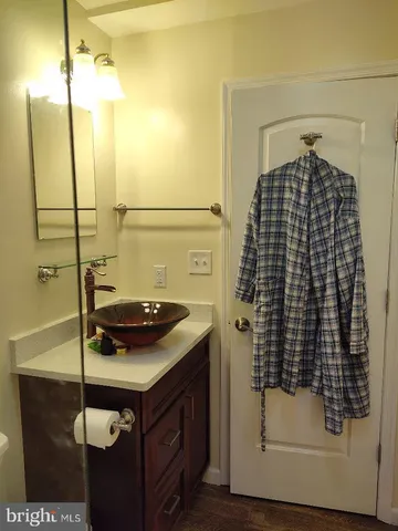 a front view of a house with swimming pool having outdoor seating