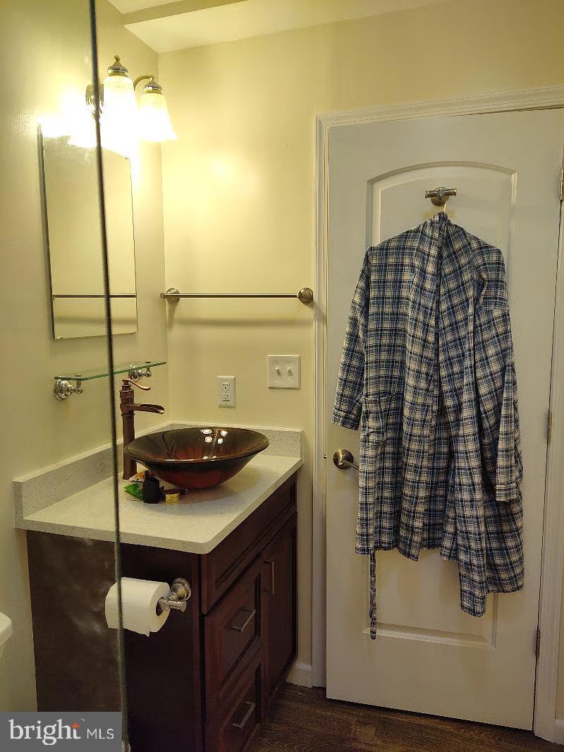 13621 North Gate Drive Silver Spring, MD 20906 - Photo 49 of 54 a bathroom with a sink and mirror
