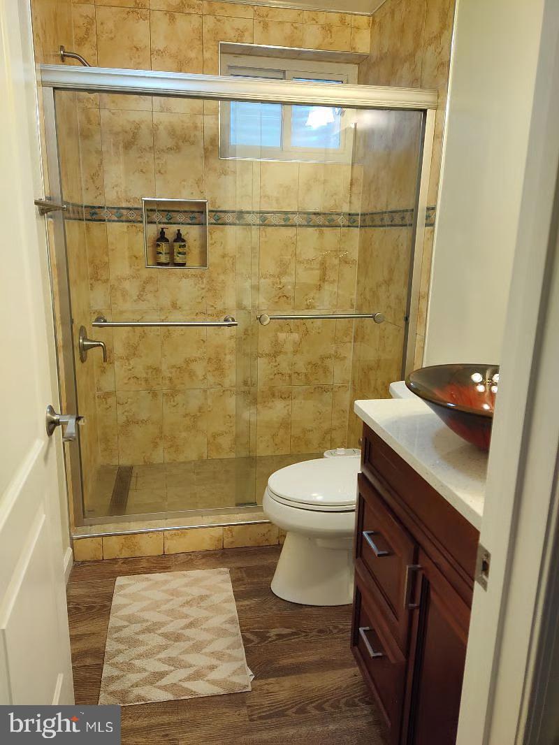 13621 North Gate Drive Silver Spring, MD 20906 - Photo 50 of 54 a bathroom with a sink a toilet and shower