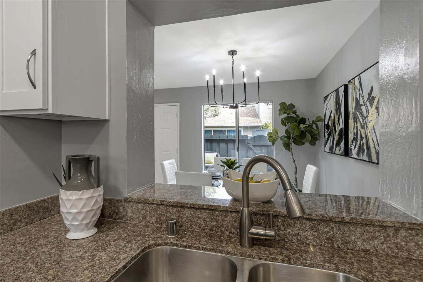 4796 Raspberry Place San Jose, CA 95129 - Photo 11 of 37 a kitchen with a sink and a refrigerator