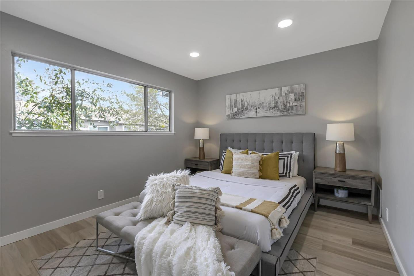 4796 Raspberry Place San Jose, CA 95129 - Photo 13 of 37 a bedroom with a bed and wooden floor