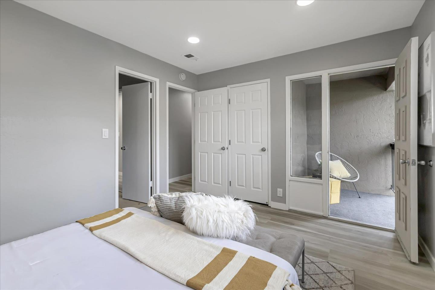 4796 Raspberry Place San Jose, CA 95129 - Photo 14 of 37 a bedroom with a bed and walk in closet