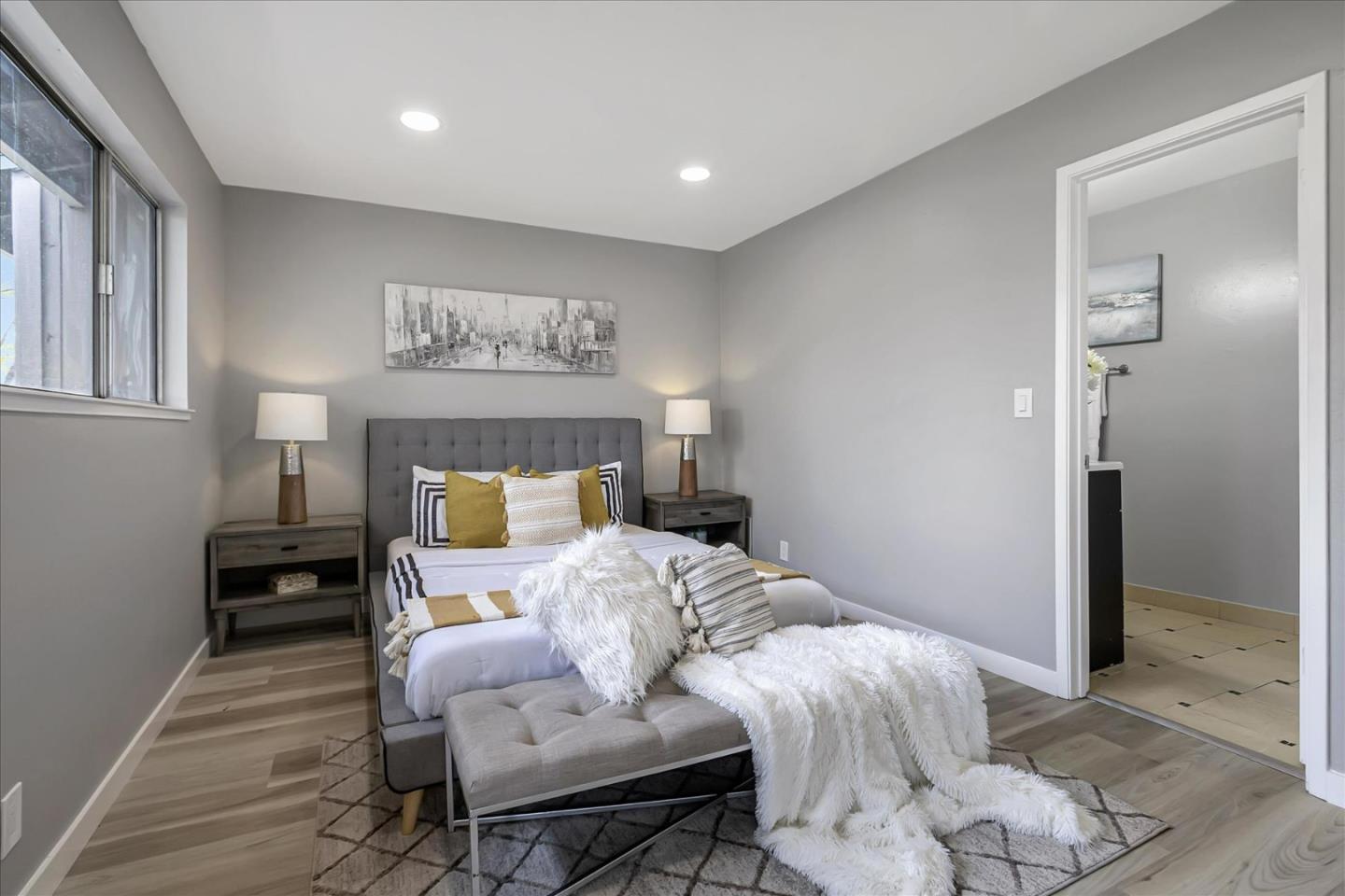 4796 Raspberry Place San Jose, CA 95129 - Photo 16 of 37 a bedroom with a bed and wooden floor