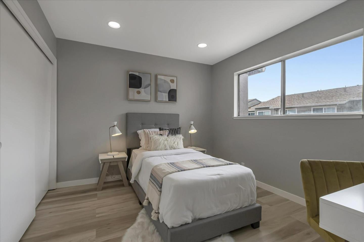 4796 Raspberry Place San Jose, CA 95129 - Photo 19 of 37 a bedroom with a bed and a couch