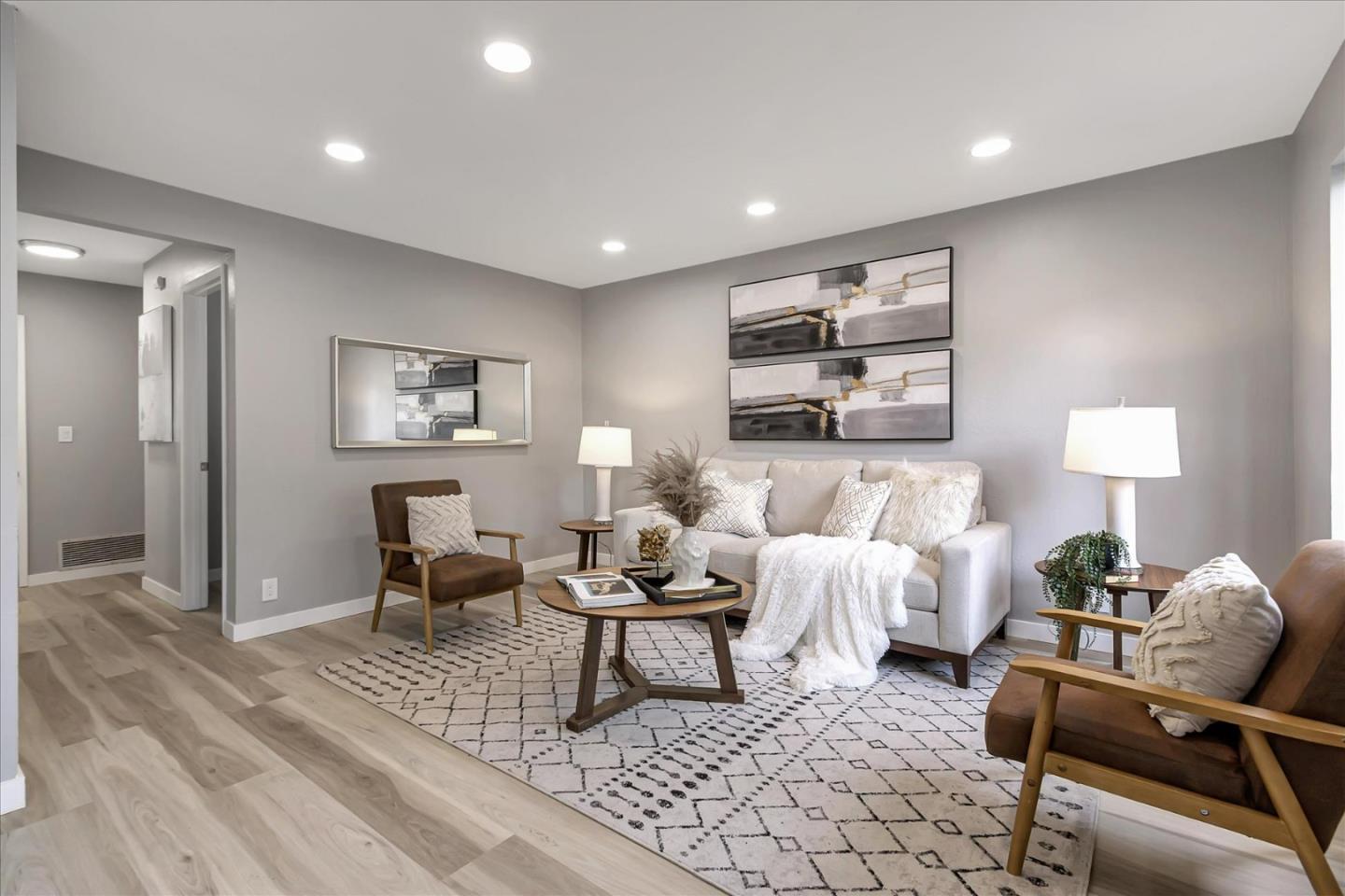 4796 Raspberry Place San Jose, CA 95129 - Photo 2 of 37 a living room with furniture and a table