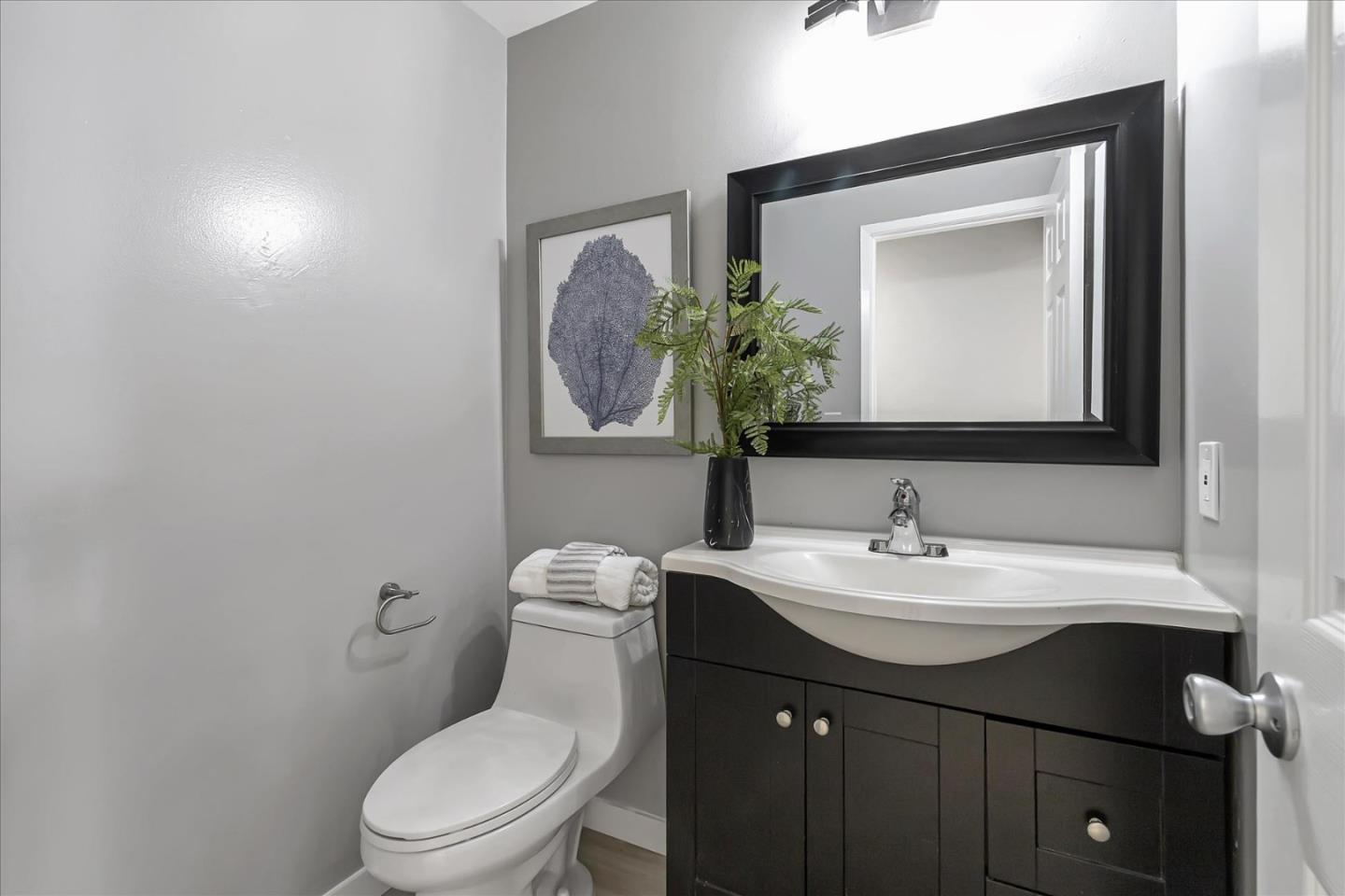 4796 Raspberry Place San Jose, CA 95129 - Photo 24 of 37 a bathroom with a toilet sink vanity and mirror