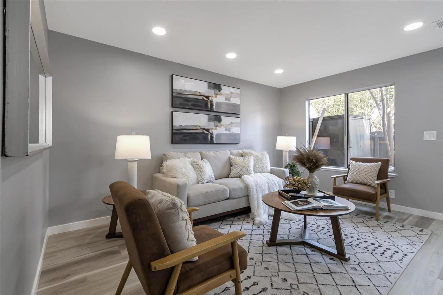 4796 Raspberry Place San Jose, CA 95129 - Photo 3 of 37 a living room with furniture and a lamp