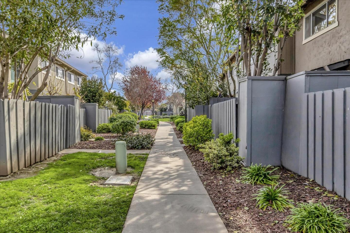 4796 Raspberry Place San Jose, CA 95129 - Photo 31 of 37 a view of a pathway with house on both side