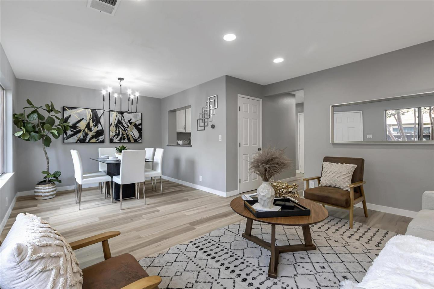 4796 Raspberry Place San Jose, CA 95129 - Photo 4 of 37 a living room with furniture and view of kitchen
