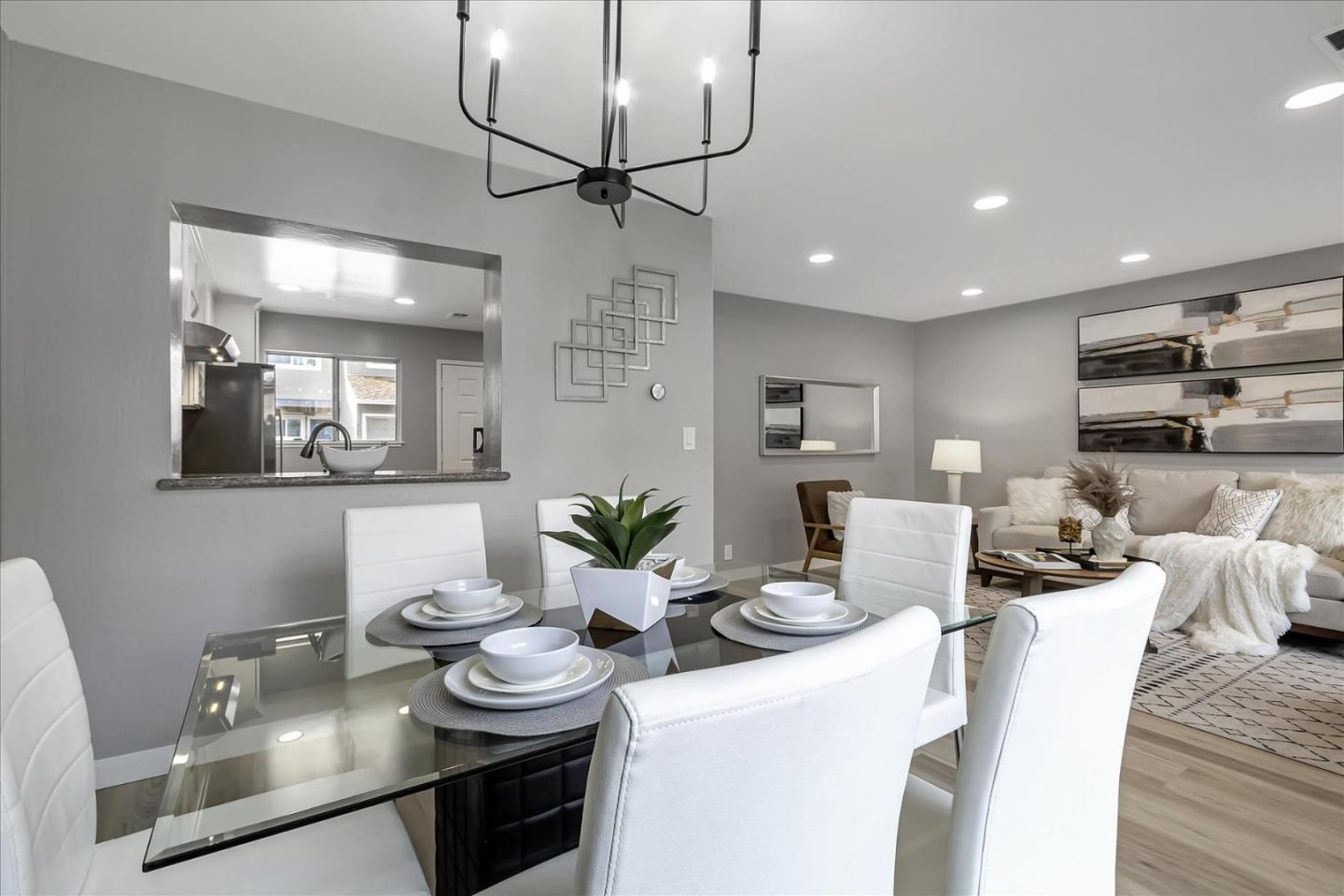 4796 Raspberry Place San Jose, CA 95129 - Photo 5 of 37 a kitchen with stainless steel appliances kitchen island granite countertop a sink and cabinets
