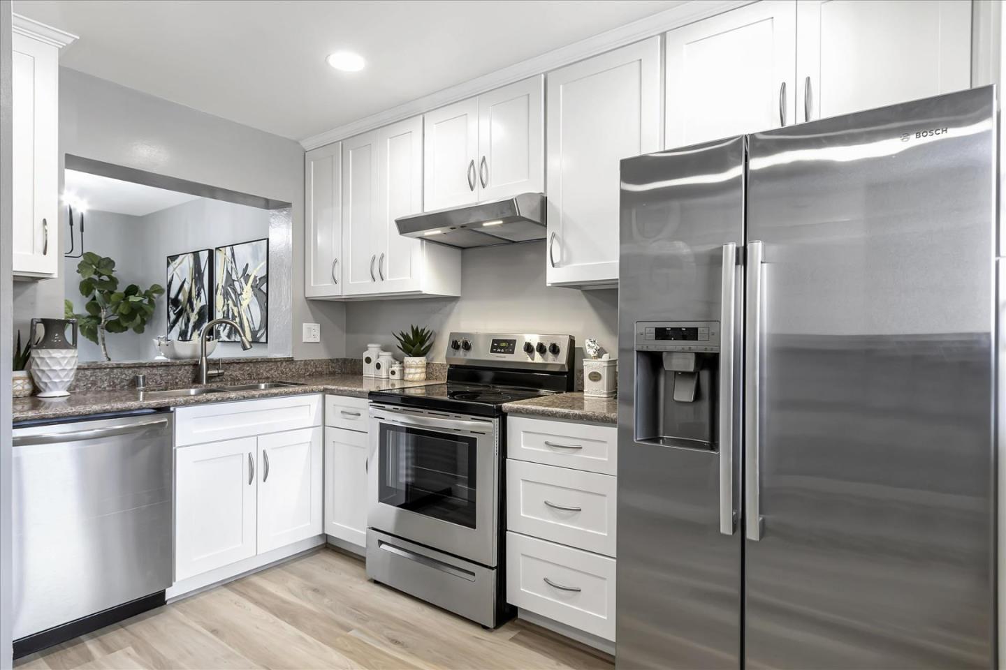4796 Raspberry Place San Jose, CA 95129 - Photo 7 of 37 a kitchen with a stove and a refrigerator