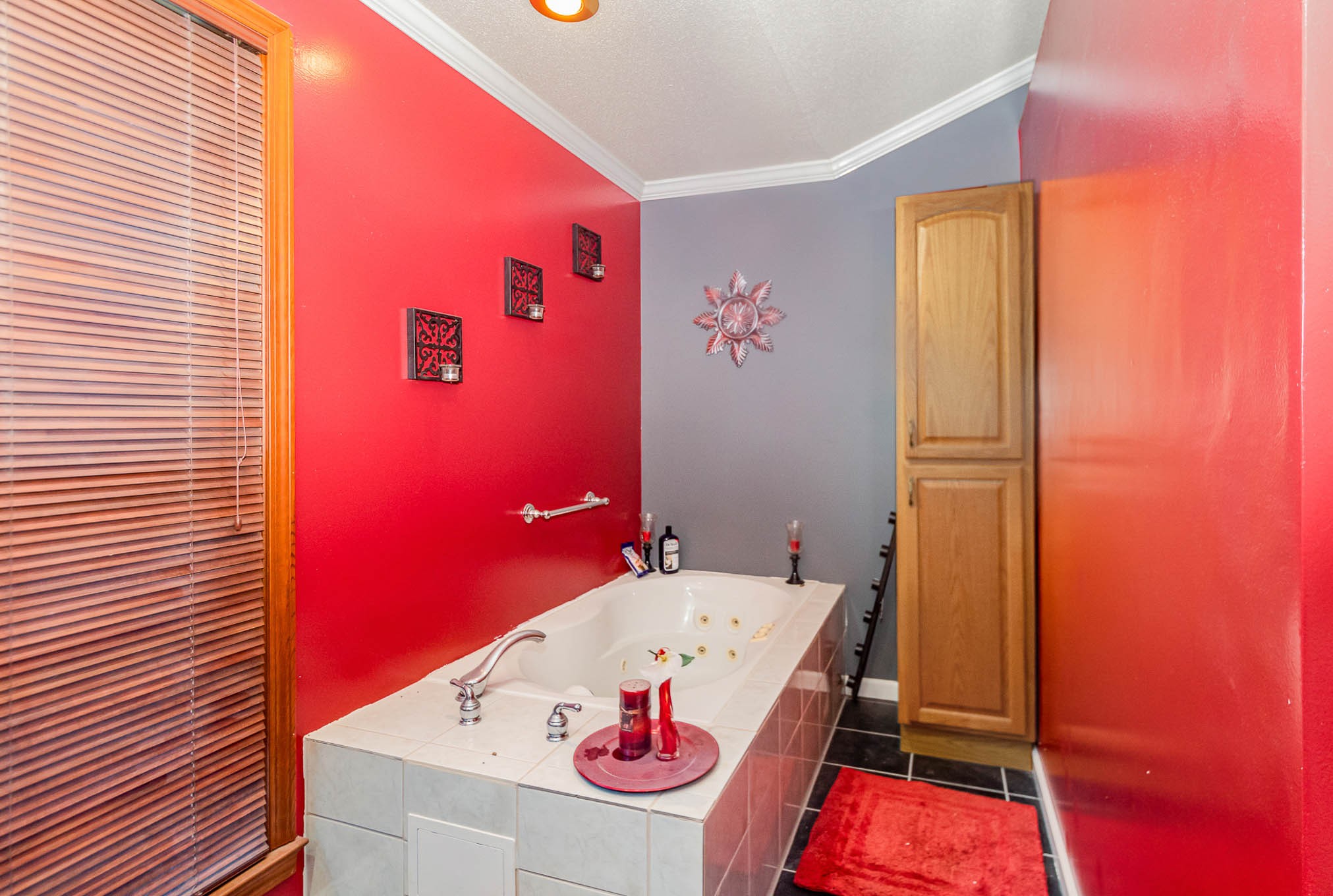 1531 Tom Moore Road Clarksville, TN 37043 - Photo 17 of 30 a bathroom with a small tub sink with wooden floor