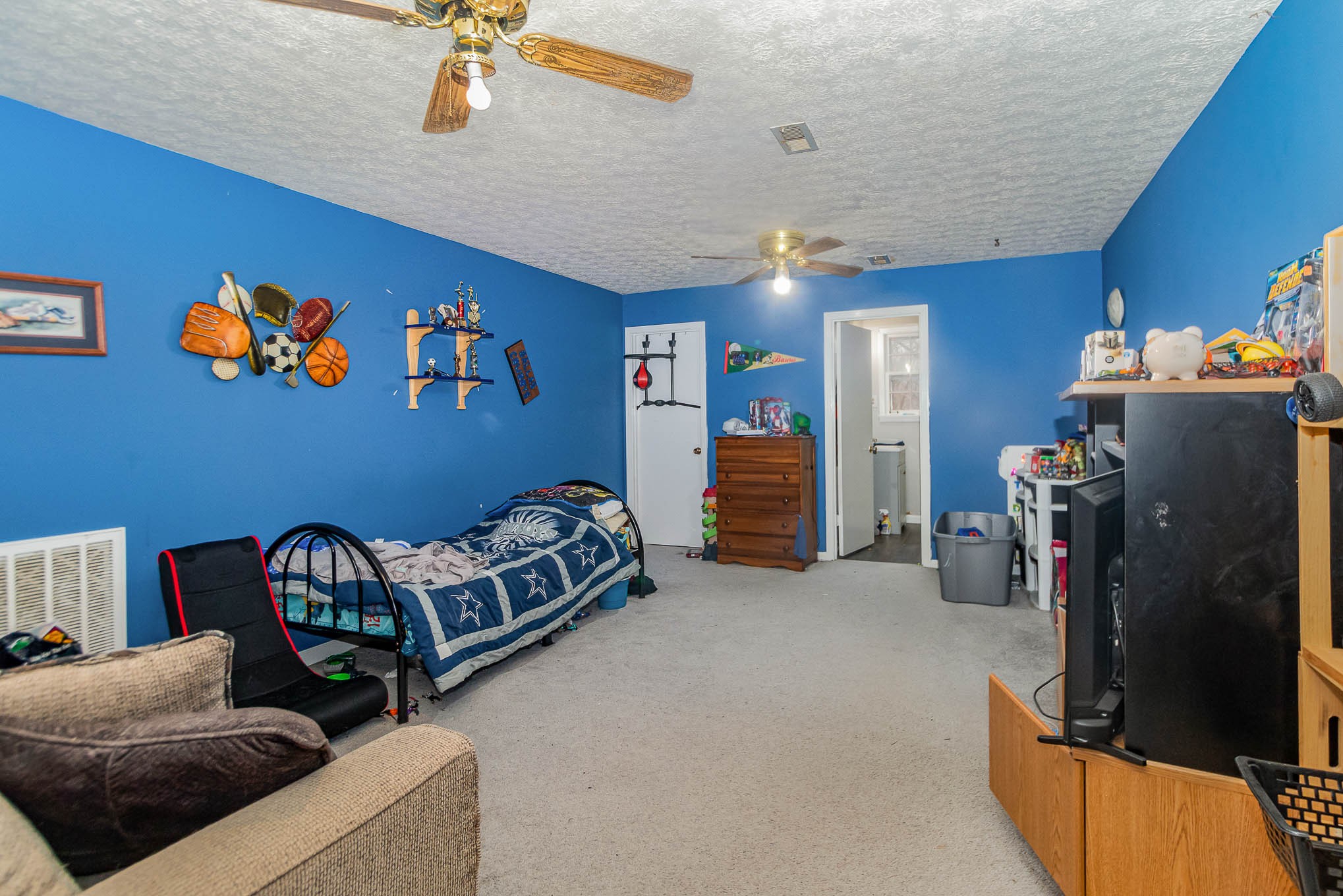 1531 Tom Moore Road Clarksville, TN 37043 - Photo 18 of 30 a bedroom with furniture and a gym machine