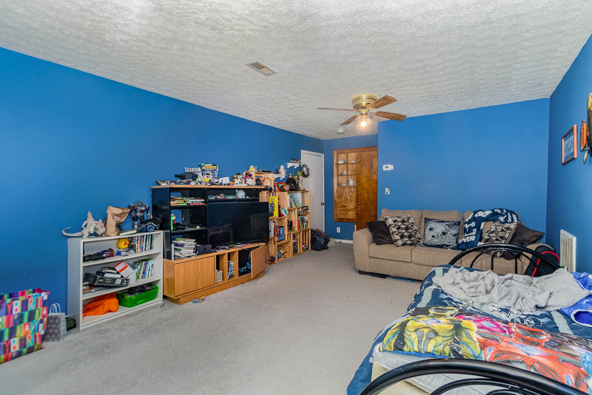 1531 Tom Moore Road Clarksville, TN 37043 - Photo 19 of 30 a bedroom with furniture and a flat screen tv