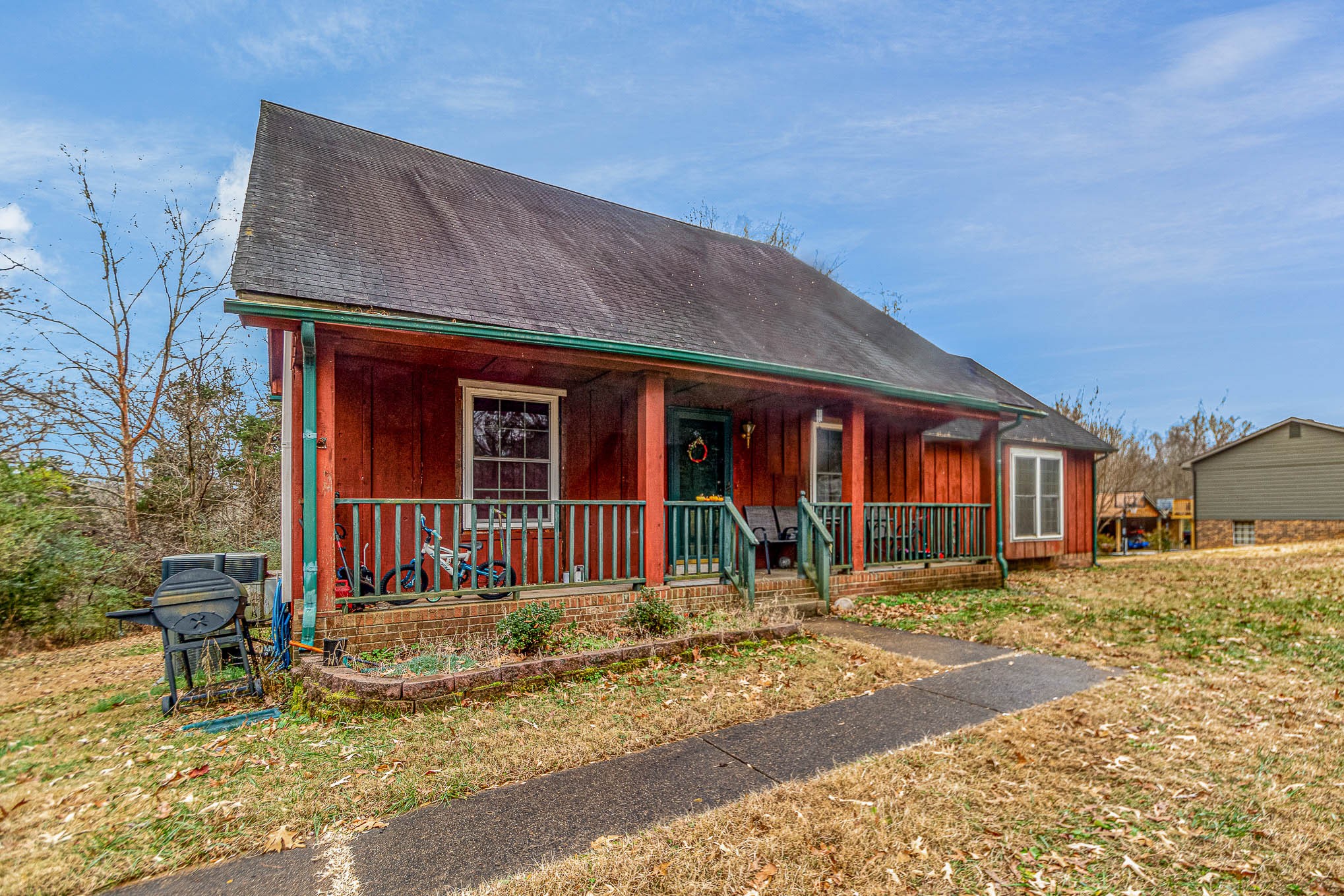 1531 Tom Moore Road Clarksville, TN 37043 - Photo 3 of 30 a front view of a house with a yard