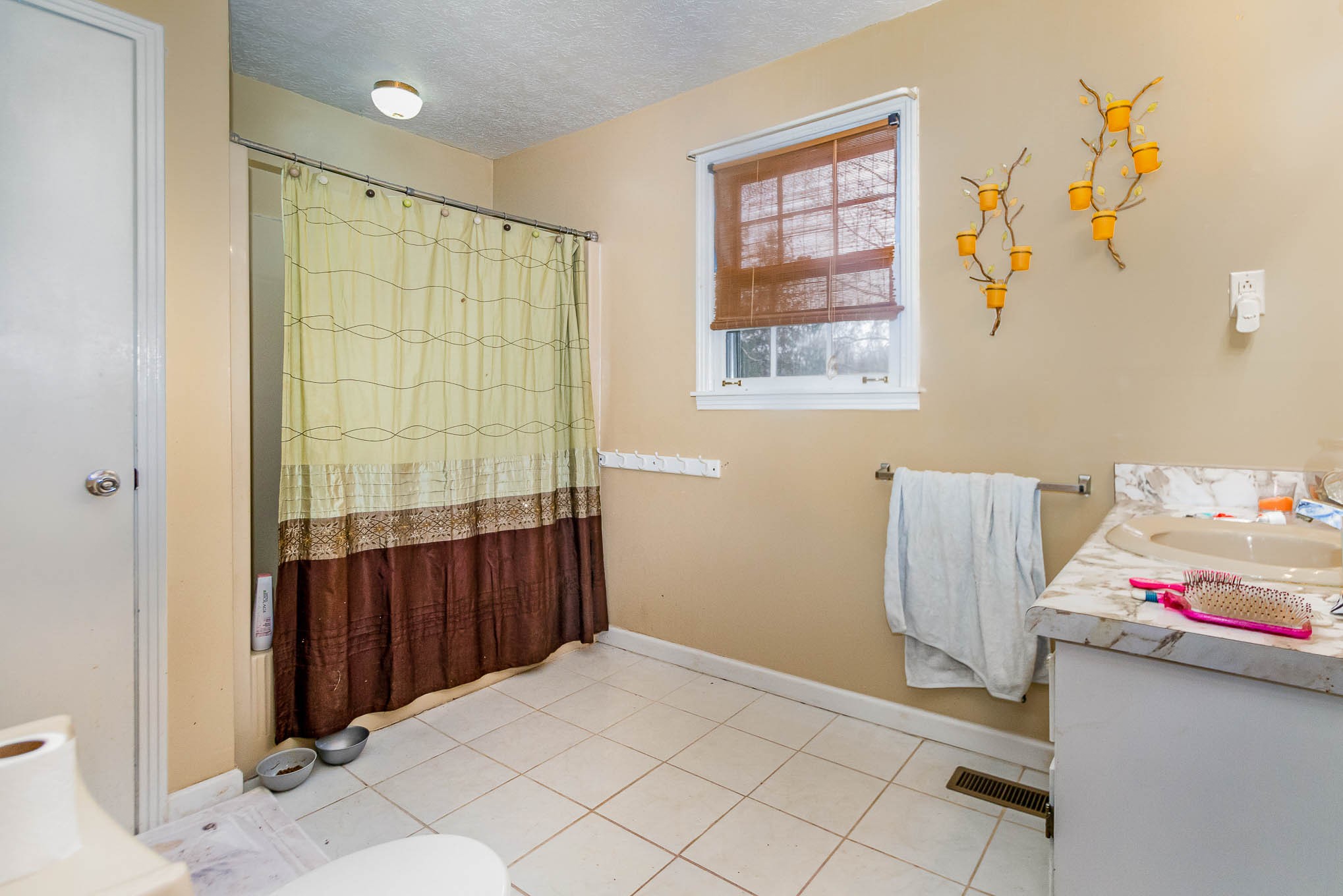 1531 Tom Moore Road Clarksville, TN 37043 - Photo 22 of 30 a bedroom with a bed and wooden floor