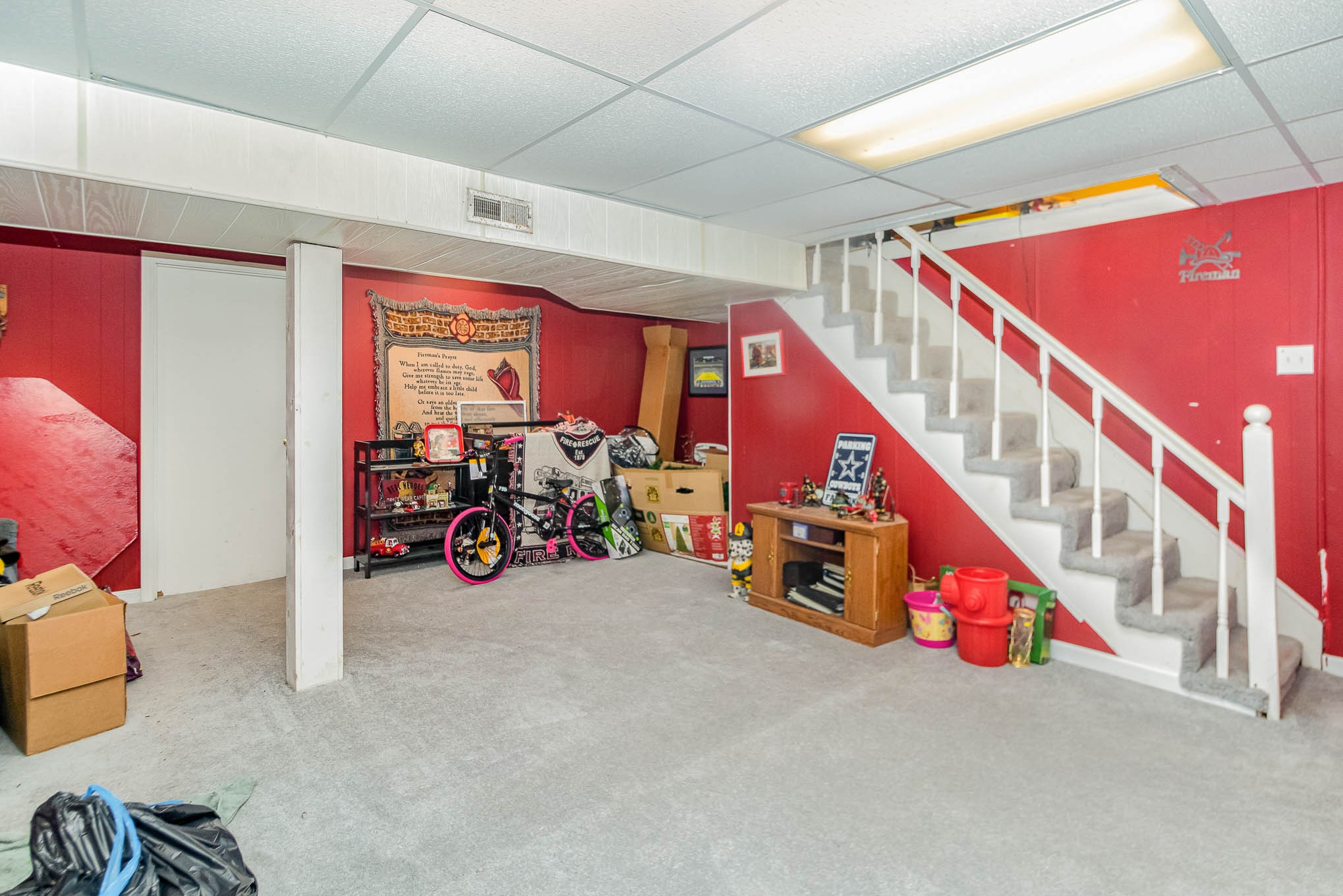 1531 Tom Moore Road Clarksville, TN 37043 - Photo 24 of 30 a view of an empty room with wooden floor and stairs