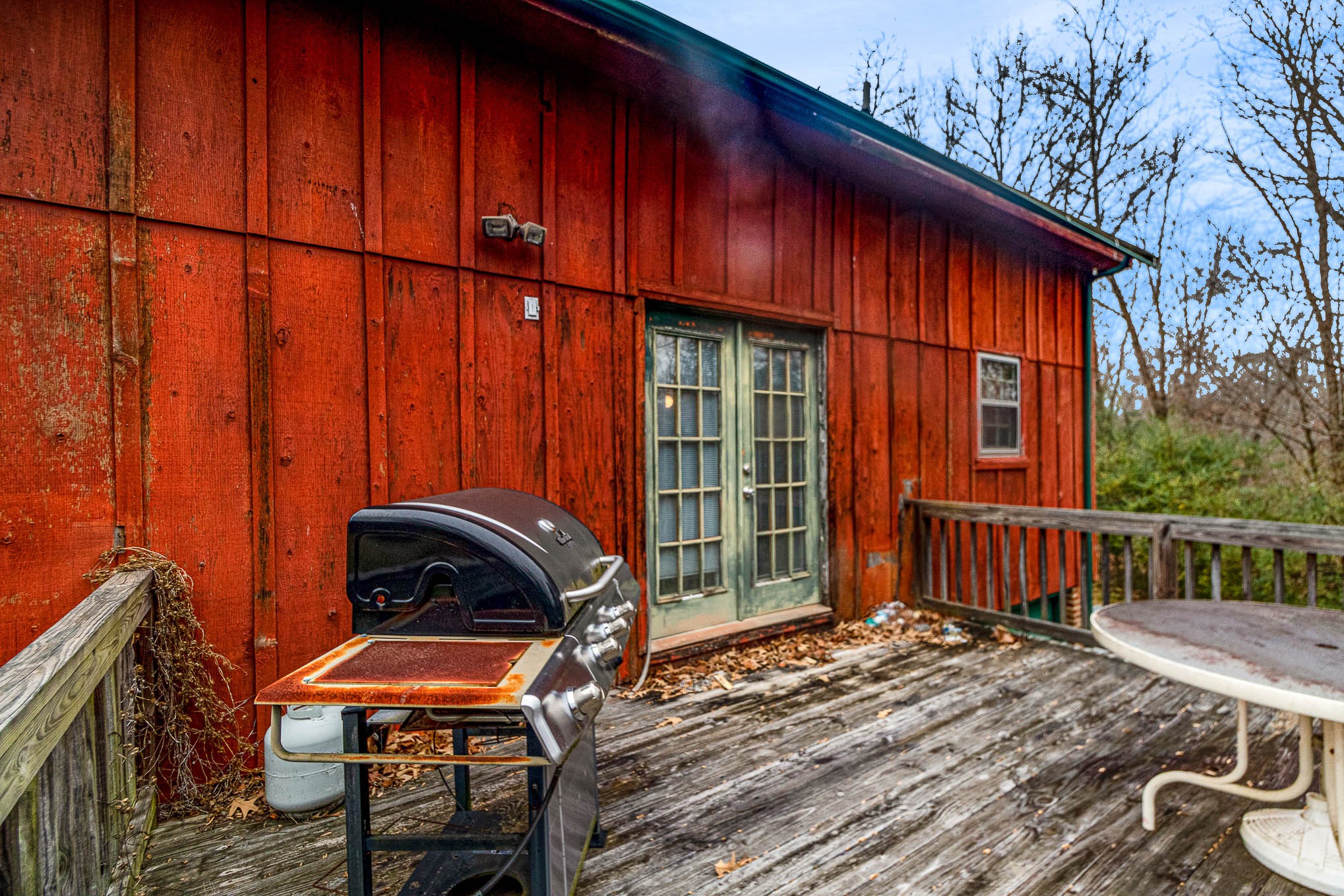 1531 Tom Moore Road Clarksville, TN 37043 - Photo 26 of 30 a backyard of a house with barbeque oven table and chairs