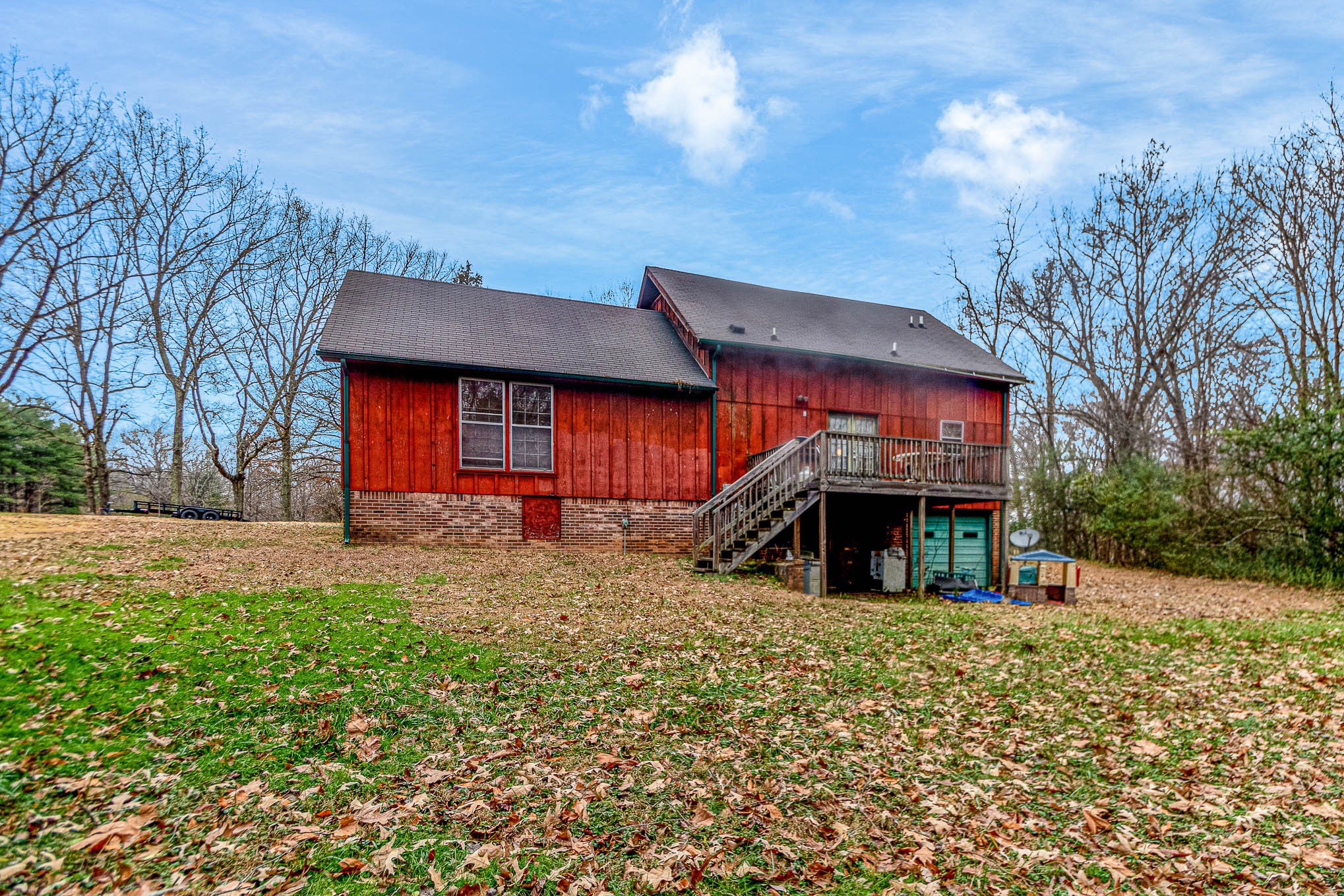 1531 Tom Moore Road Clarksville, TN 37043 - Photo 27 of 30 a view of a house with a yard and large tree
