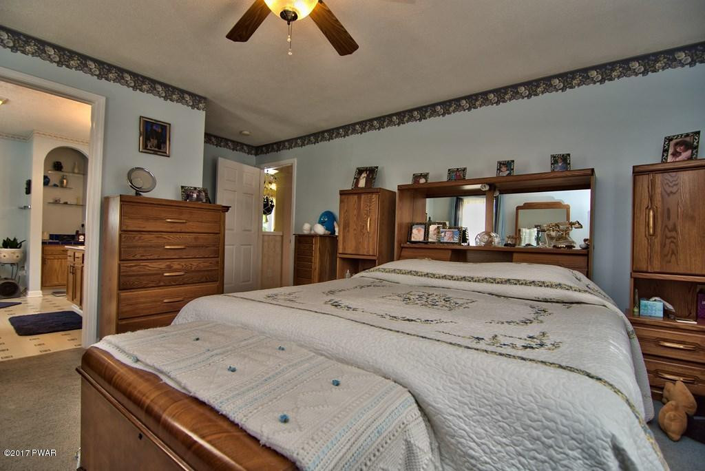 145 Keystone Road Lake Ariel, PA 18436 - Photo 6 of 52 a bedroom with a bed and a television