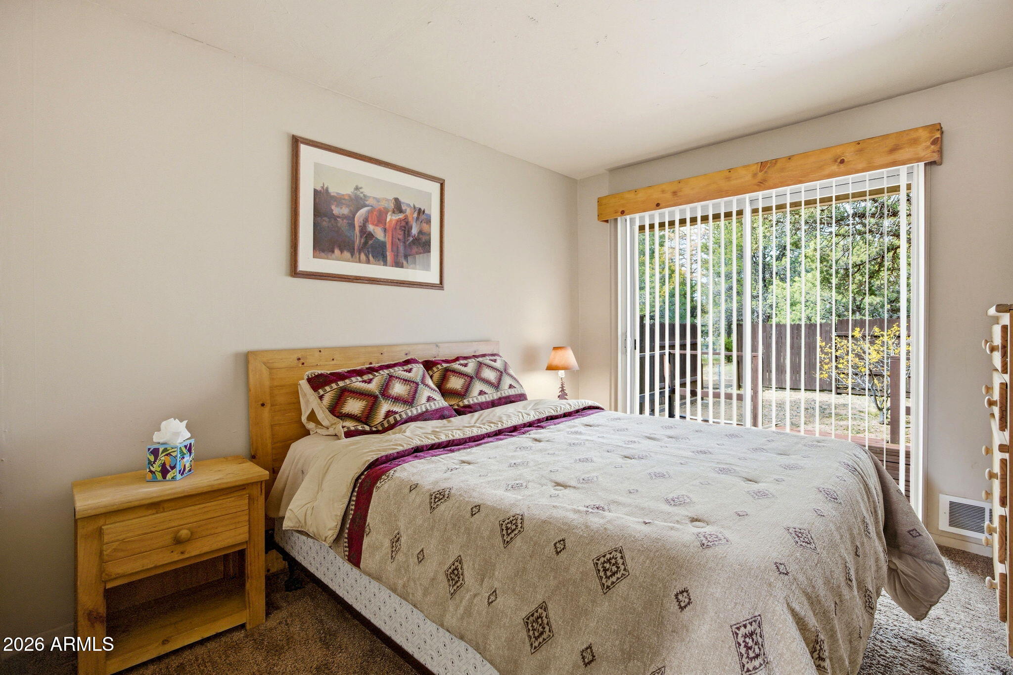 3072 Chevelon Road Overgaard, AZ 85933 - Photo 15 of 51 a bedroom with a bed and a window