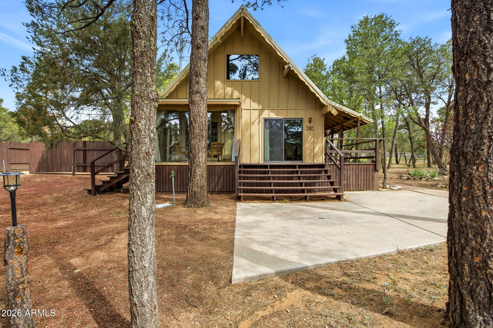 3072 Chevelon Road Overgaard, AZ 85933 - Photo 28 of 51 a front view of a house with a yard