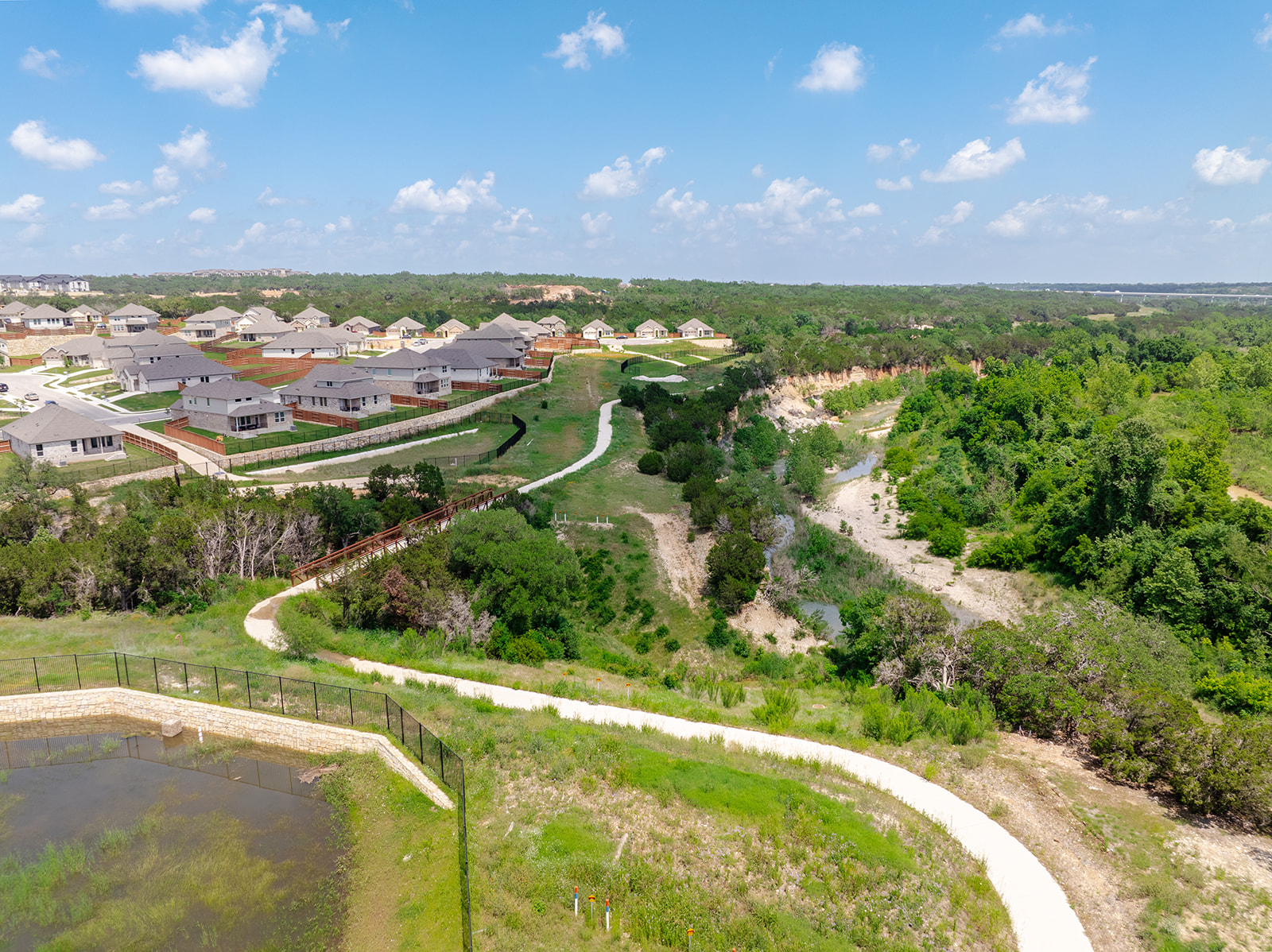 900 Balsora Cove Georgetown, TX 78628 - Photo 38 of 39 Discover a scenic new community with nature trails and expansive green spaces, perfect for outdoor living.