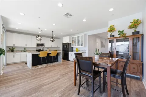 a kitchen with a table and chairs in it