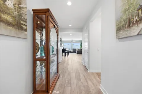 a view of a hallway and wooden floor