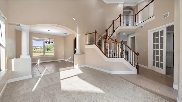 a view of staircase with lots of frames and stairs