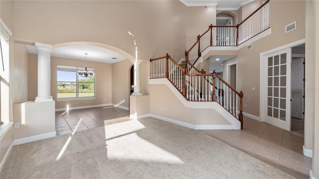 10651 Arrowtree Boulevard Clermont, FL 34715 - Photo 11 of 51 a view of entryway and hall with wooden floor