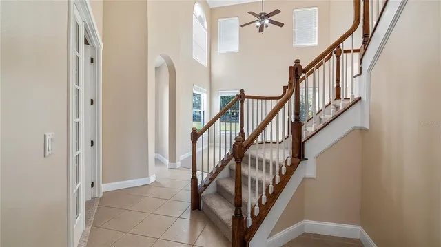 a view of a hallway with windows and entryway