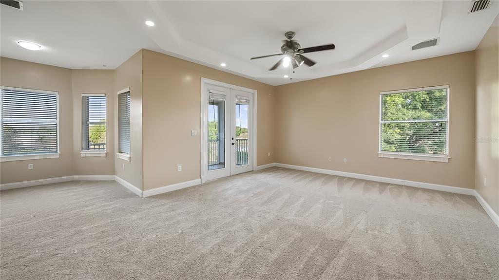 10651 Arrowtree Boulevard Clermont, FL 34715 - Photo 25 of 51 an empty room with windows and closet