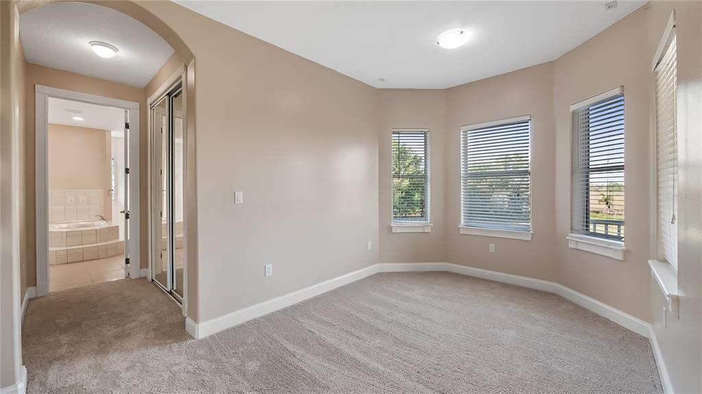 10651 Arrowtree Boulevard Clermont, FL 34715 - Photo 27 of 51 an empty room with windows and closet