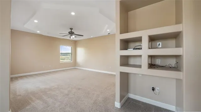 a spacious bathroom with a double vanity sink a mirror and a bathtub
